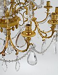Drop-shaped pendeloque prisms on a chandelier.